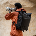 Rolltop pro camera backpack made for mobile crews—strap in your tripod, slide onto your luggage.